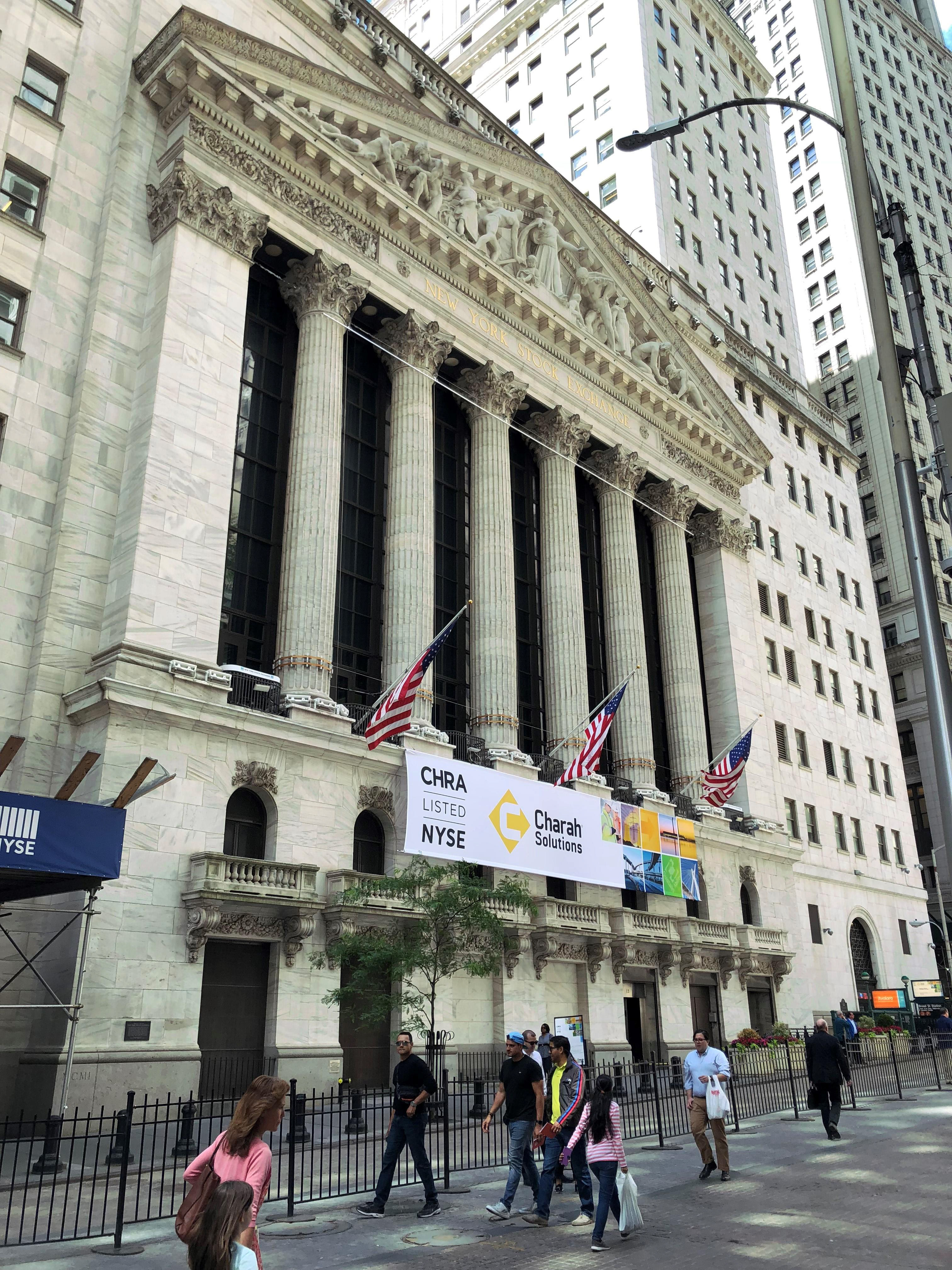 Wide view of NYSE building showcasing the scale of brand presence