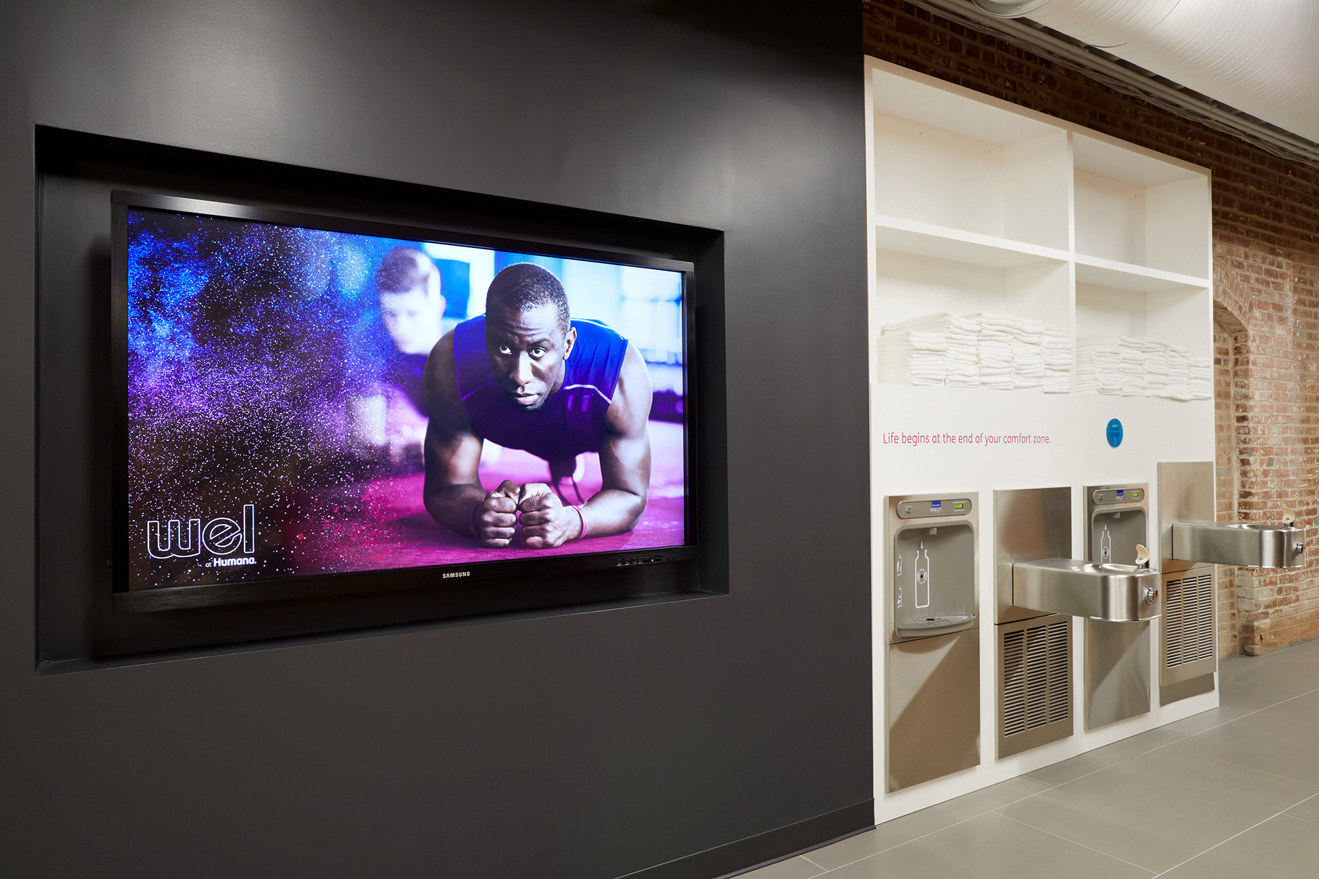 Branded digital display with motivational content and hydration station area