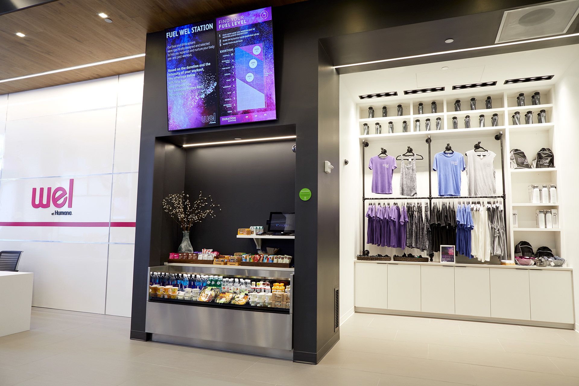 Fuel Wel Station interior with digital displays and branded merchandise retail area