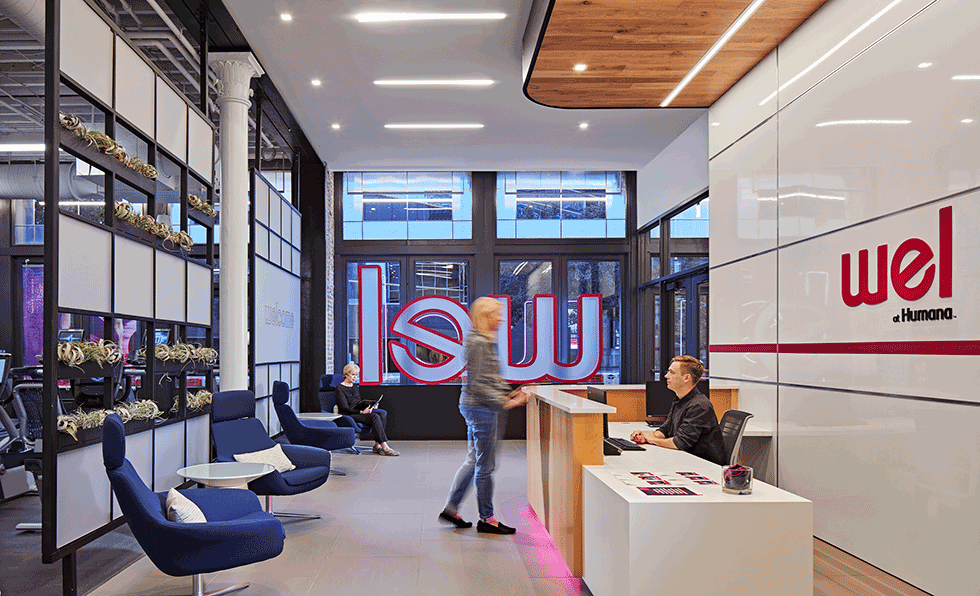 Wel at Humana lobby with iconic 3D lettering, modern lounge seating, and reception desk